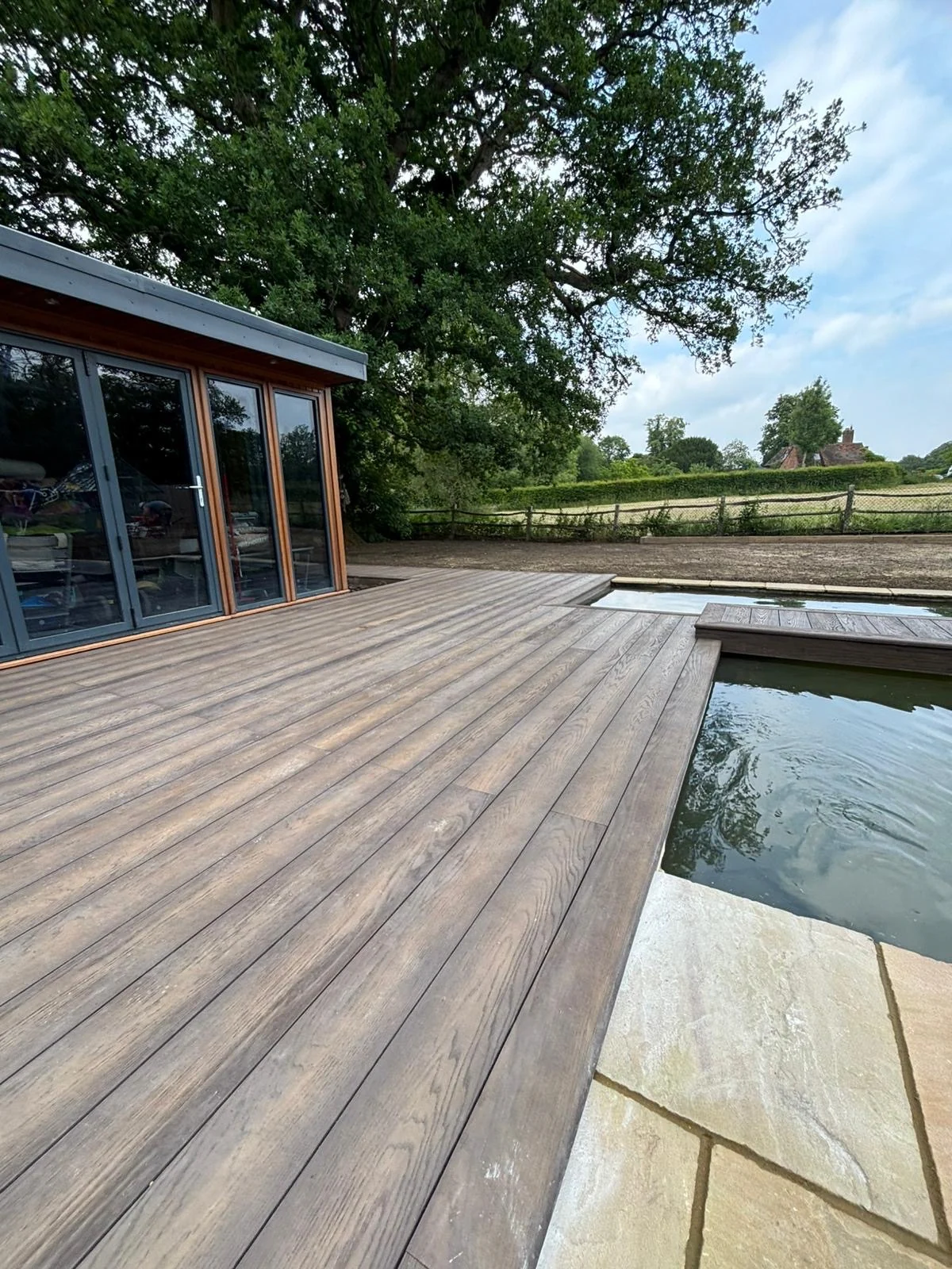 Bespoke garden room set within a landscaped garden
