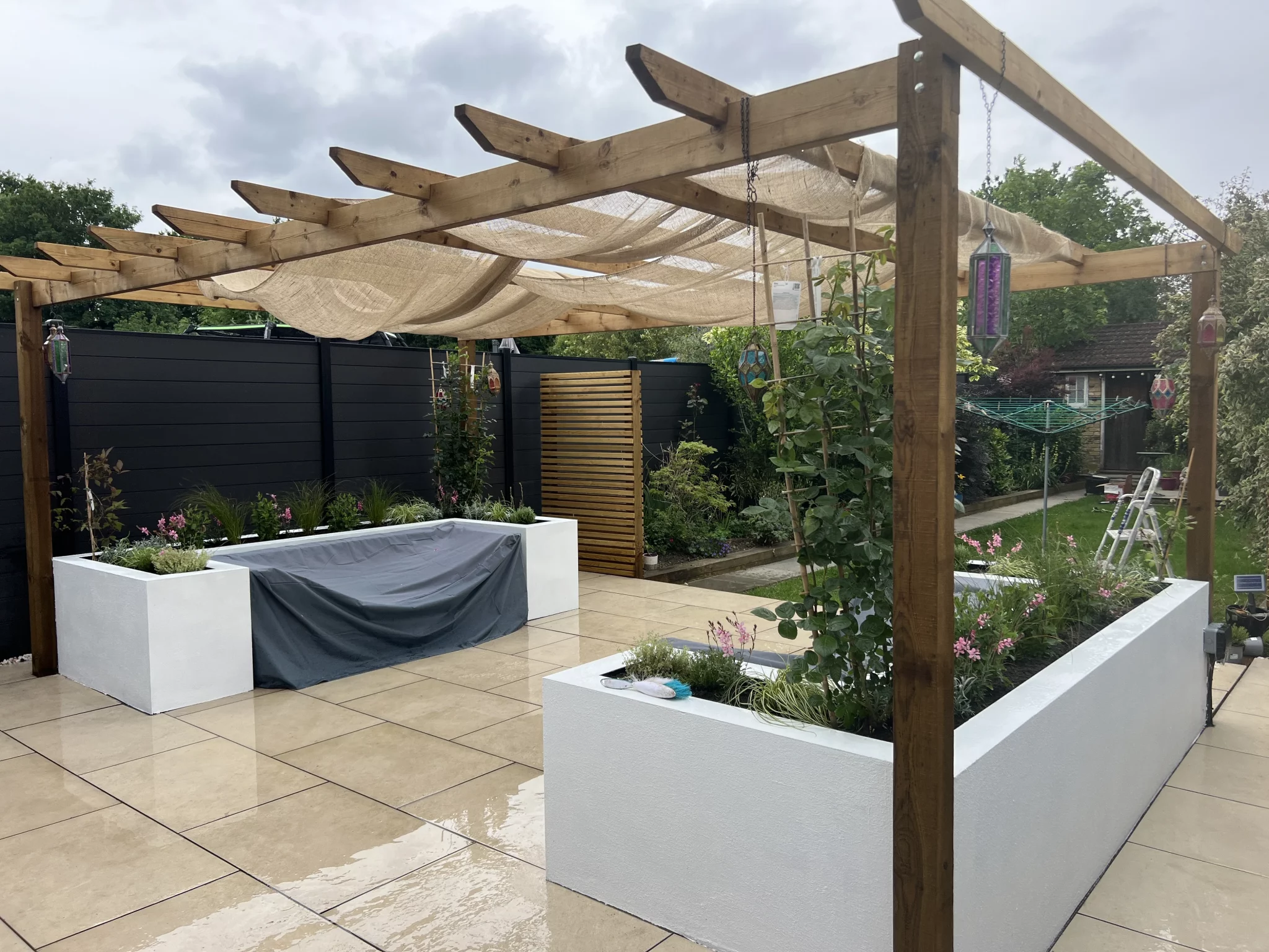 Pergola and outdoor seating area within a landscaped garden